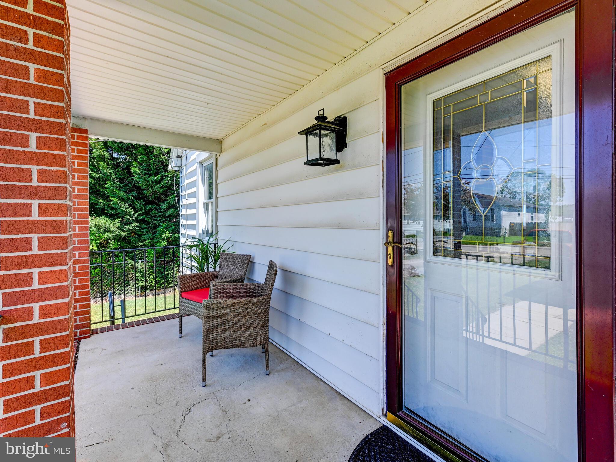 3932 Glenhurst Road Baltimore, MD 21222 - Photo 7 of 47 a bench sitting in front of a door