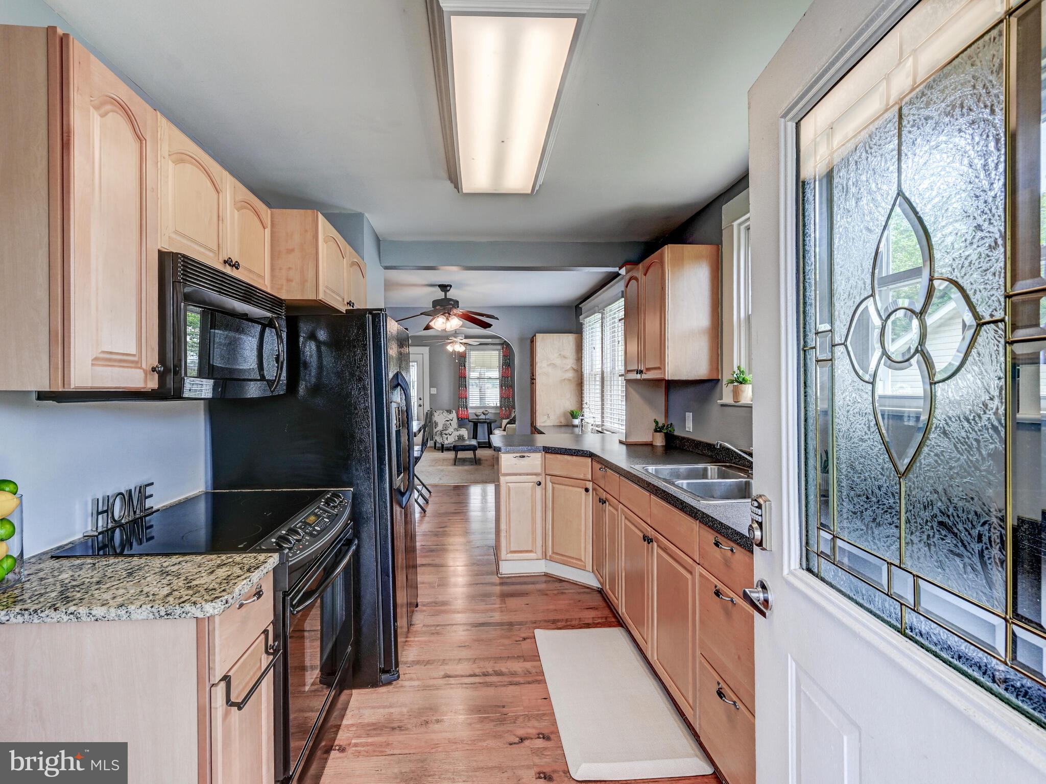3932 Glenhurst Road Baltimore, MD 21222 - Photo 8 of 47 a kitchen with stainless steel appliances granite countertop a stove top oven a sink a counter space and cabinets