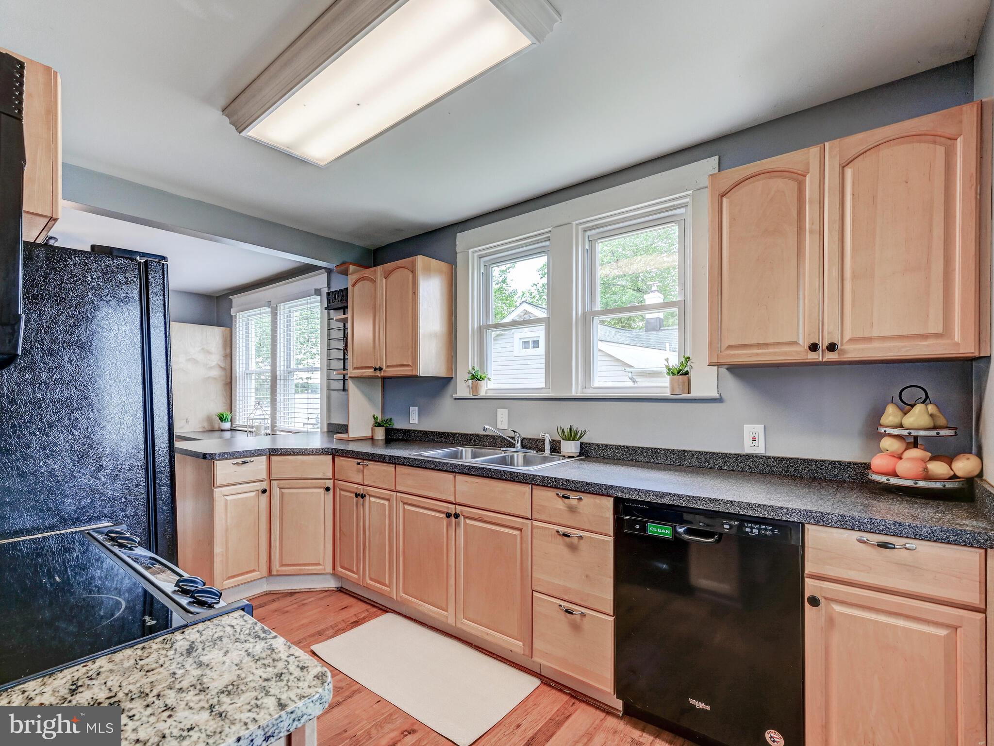 3932 Glenhurst Road Baltimore, MD 21222 - Photo 9 of 47 a kitchen with stainless steel appliances granite countertop a sink stove and cabinets