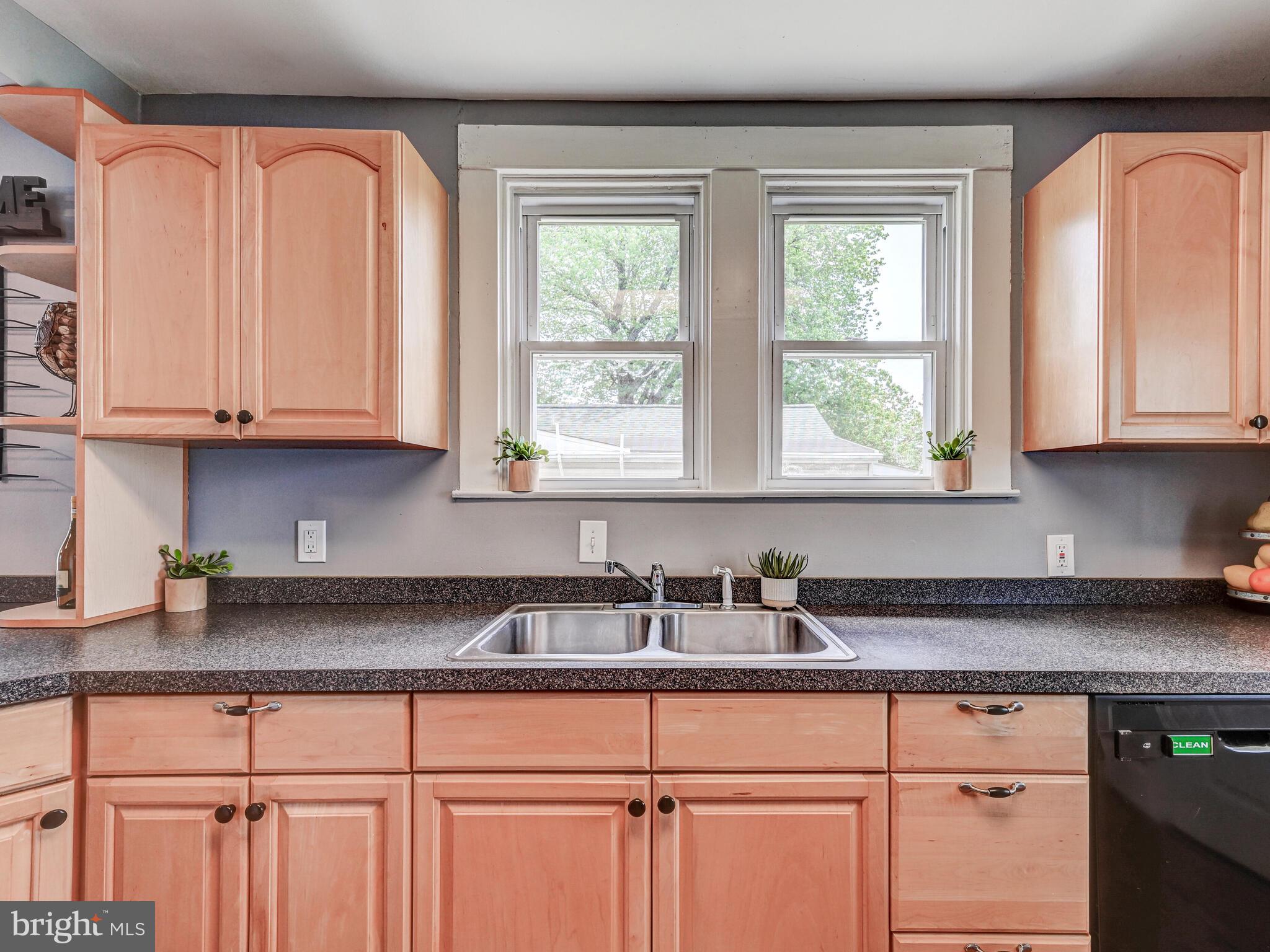 3932 Glenhurst Road Baltimore, MD 21222 - Photo 10 of 47 a kitchen with granite countertop white cabinets and window