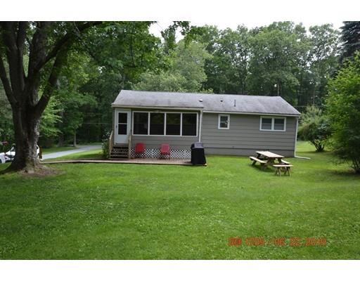 651 Sterling Road Lancaster, MA 01523 - Photo 3 of 12 a front view of a house with a yard