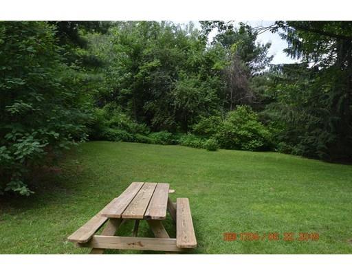 651 Sterling Road Lancaster, MA 01523 - Photo 4 of 12 a view of a backyard with a garden