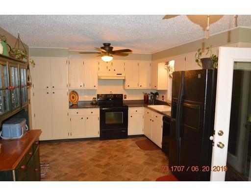 651 Sterling Road Lancaster, MA 01523 - Photo 6 of 12 a kitchen with a refrigerator and a sink