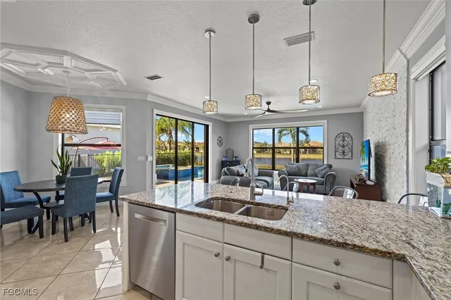 a kitchen with counter top space and dining table