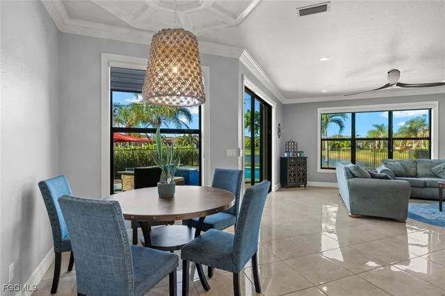 a view of a dining room with furniture window and outside view
