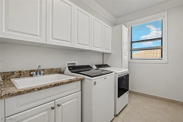 a view of a kitchen with sink and dishwasher