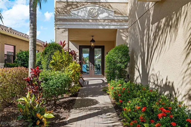 a view of a house with potted plants