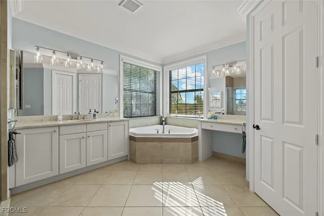 a bathroom with a shower sink and mirror