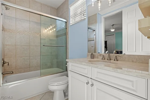 a bed room with furniture and a ceiling fan