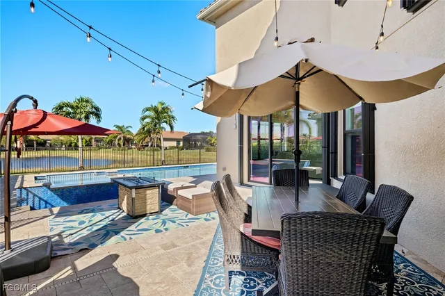 a front view of house with yard and outdoor seating