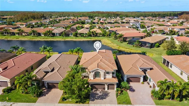 a view of a backyard with plants and patio