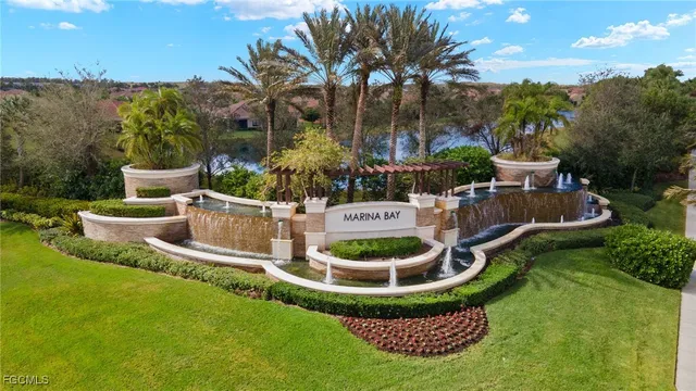 a living room with furniture a chandelier and a large window