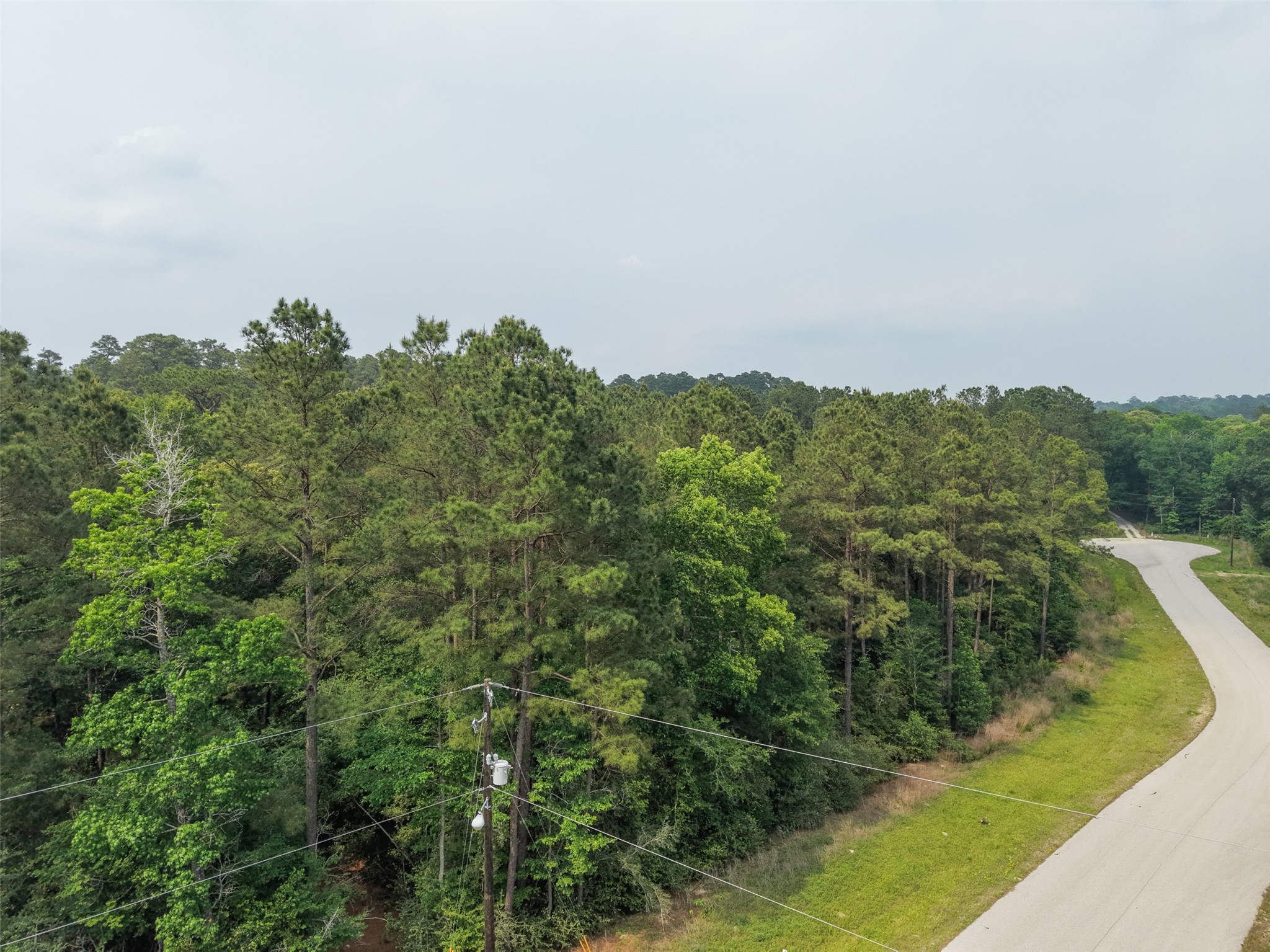 12-22-76 Granite Road Conroe, TX 77304 - Photo 7 of 21 an aerial view of a residential houses with outdoor space and trees