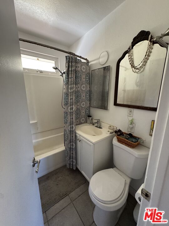 1724 Broadway Street Oceanside, CA 92054 - Photo 11 of 19 a bathroom with a toilet sink and mirror