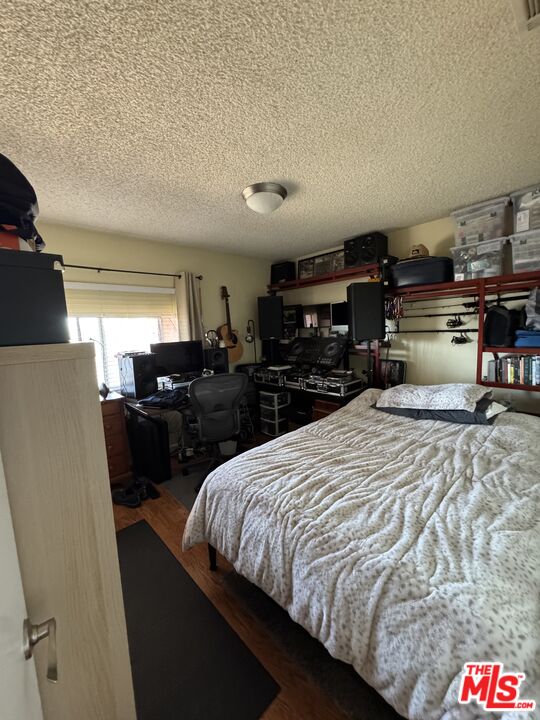 1724 Broadway Street Oceanside, CA 92054 - Photo 12 of 19 a bed room with a bed and a television