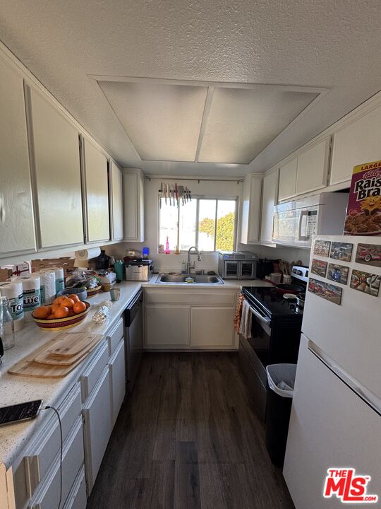 1724 Broadway Street Oceanside, CA 92054 - Photo 13 of 19 a kitchen with a sink stove and cabinets