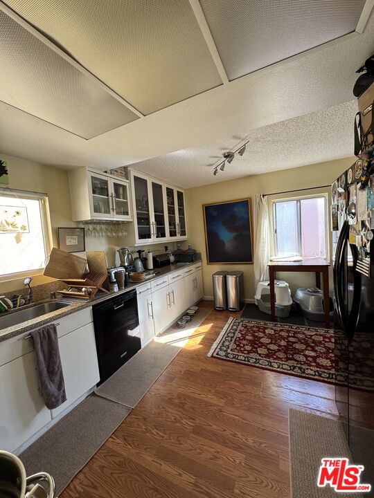 1724 Broadway Street Oceanside, CA 92054 - Photo 18 of 19 a large kitchen with stainless steel appliances granite countertop a stove and cabinets