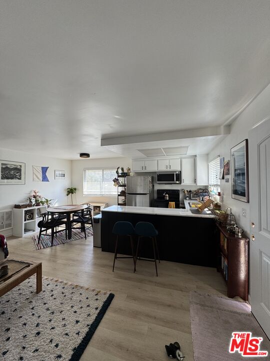 1724 Broadway Street Oceanside, CA 92054 - Photo 2 of 19 a living room with lots of furniture and kitchen view