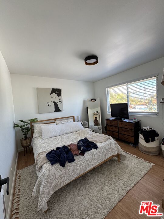 1724 Broadway Street Oceanside, CA 92054 - Photo 4 of 19 a bedroom with a bed and a couch