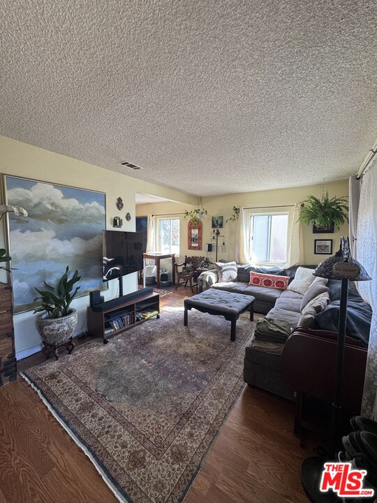 1724 Broadway Street Oceanside, CA 92054 - Photo 10 of 19 a living room with furniture and a rug