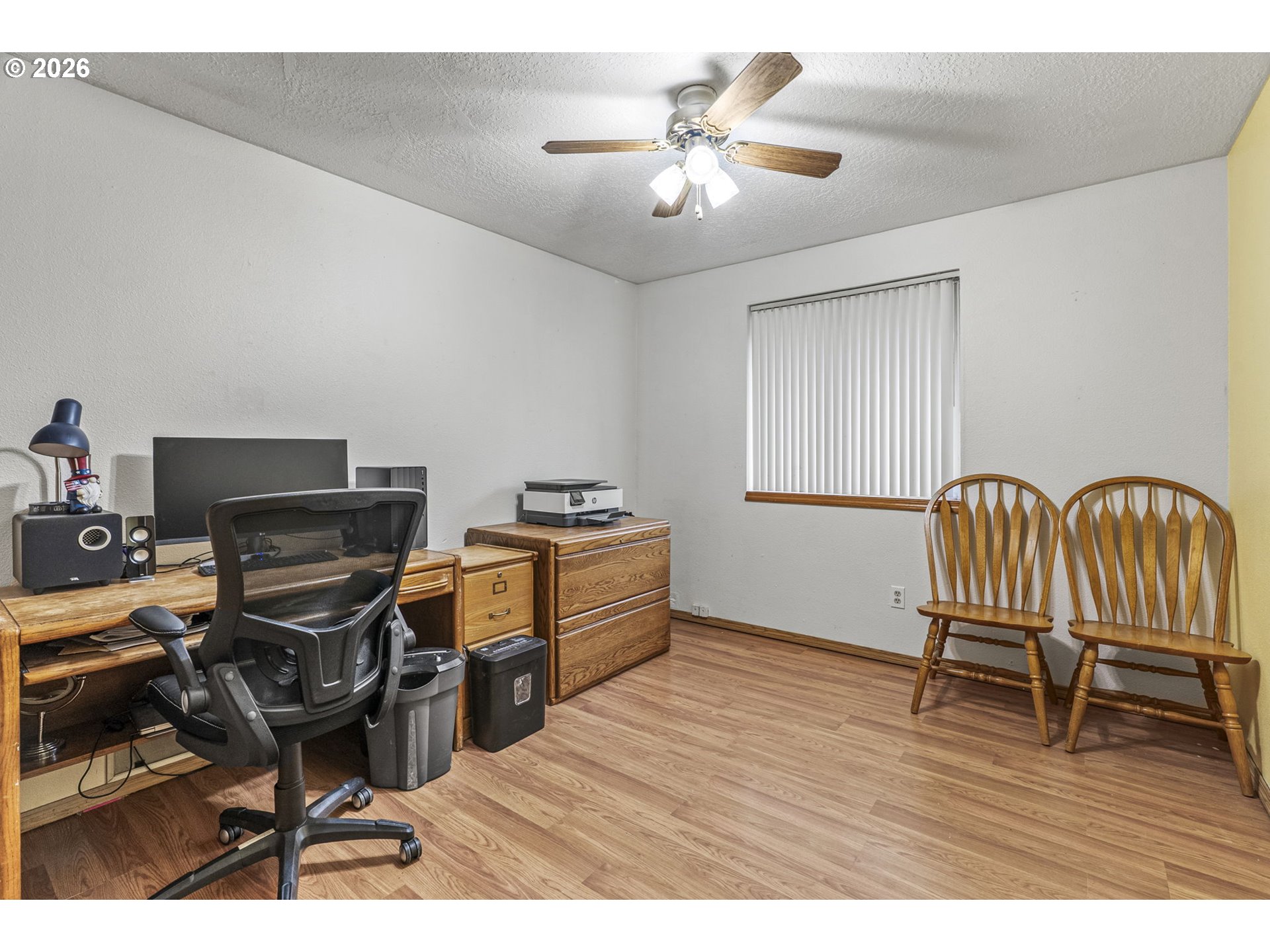 1102 South 11th Avenue Kelso, WA 98626 - Photo 18 of 32 a view of a workspace with furniture and wooden floor