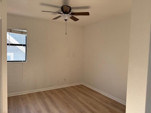 809 Bath Street, Unit 811 Santa Barbara, CA 93101 - Photo 13 of 13 an empty room with a window and a ceiling fan
