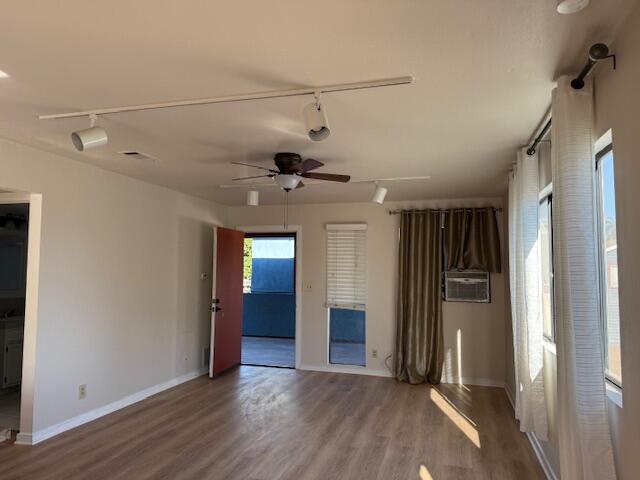 809 Bath Street, Unit 811 Santa Barbara, CA 93101 - Photo 10 of 13 an empty room with closet and windows