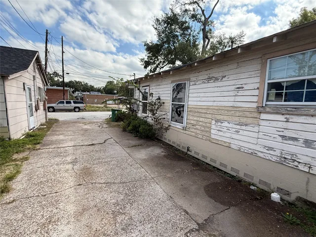 a view of a backyard with sitting area
