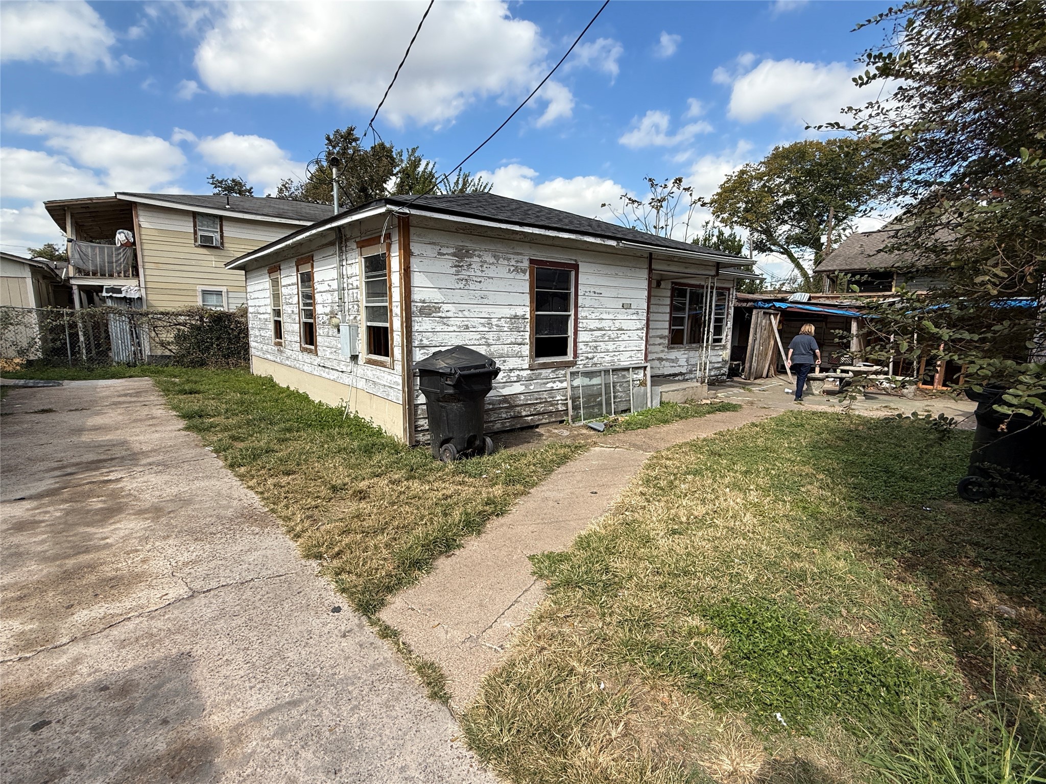 4011-4017 Terry Street Houston, TX 77009 - Photo 19 of 48 a front view of house with yard outdoor seating and barbeque