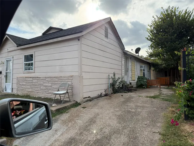 a view of a two chairs in the back yard