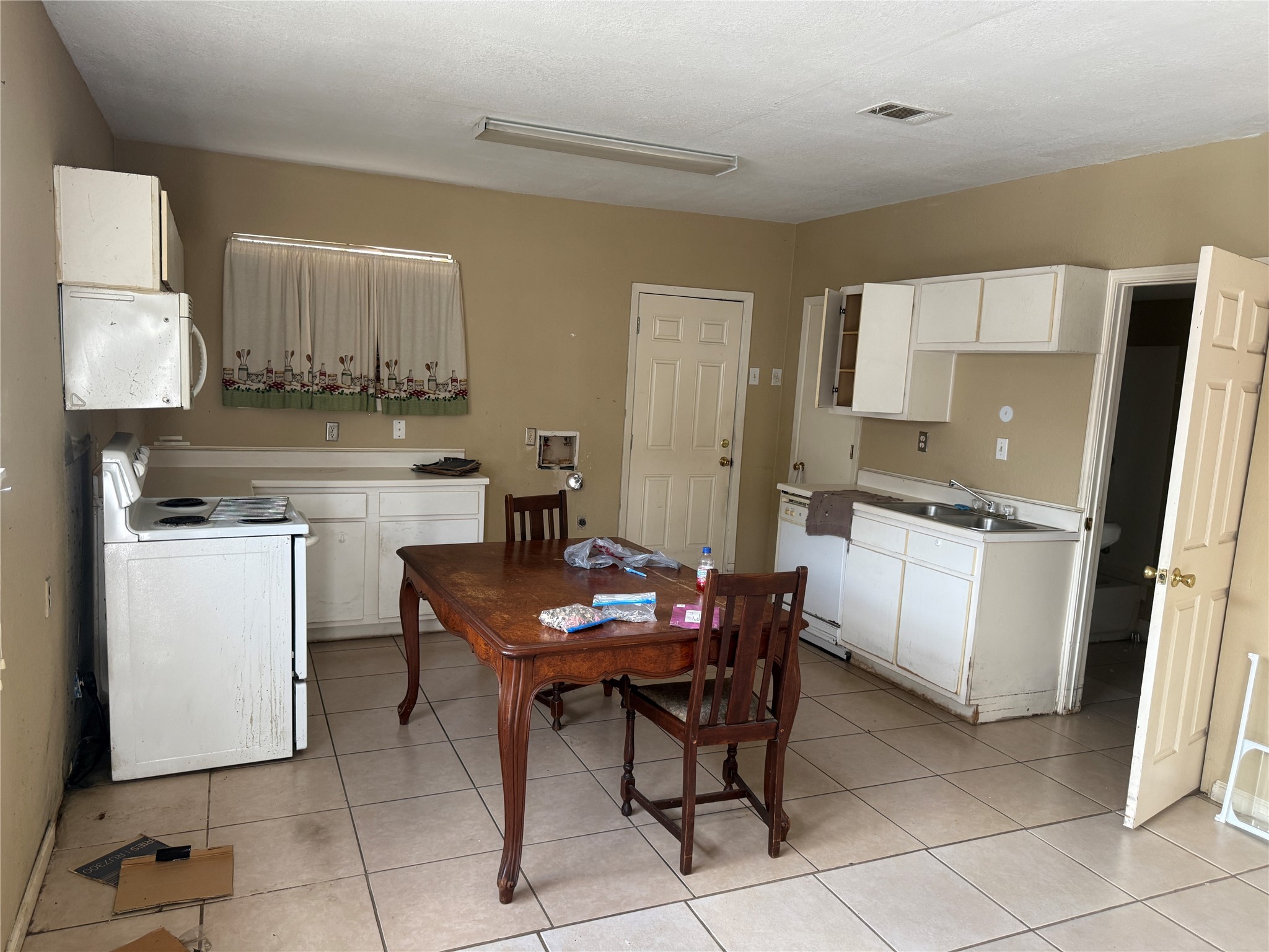 4011-4017 Terry Street Houston, TX 77009 - Photo 32 of 48 a kitchen with a sink cabinets and wooden floor