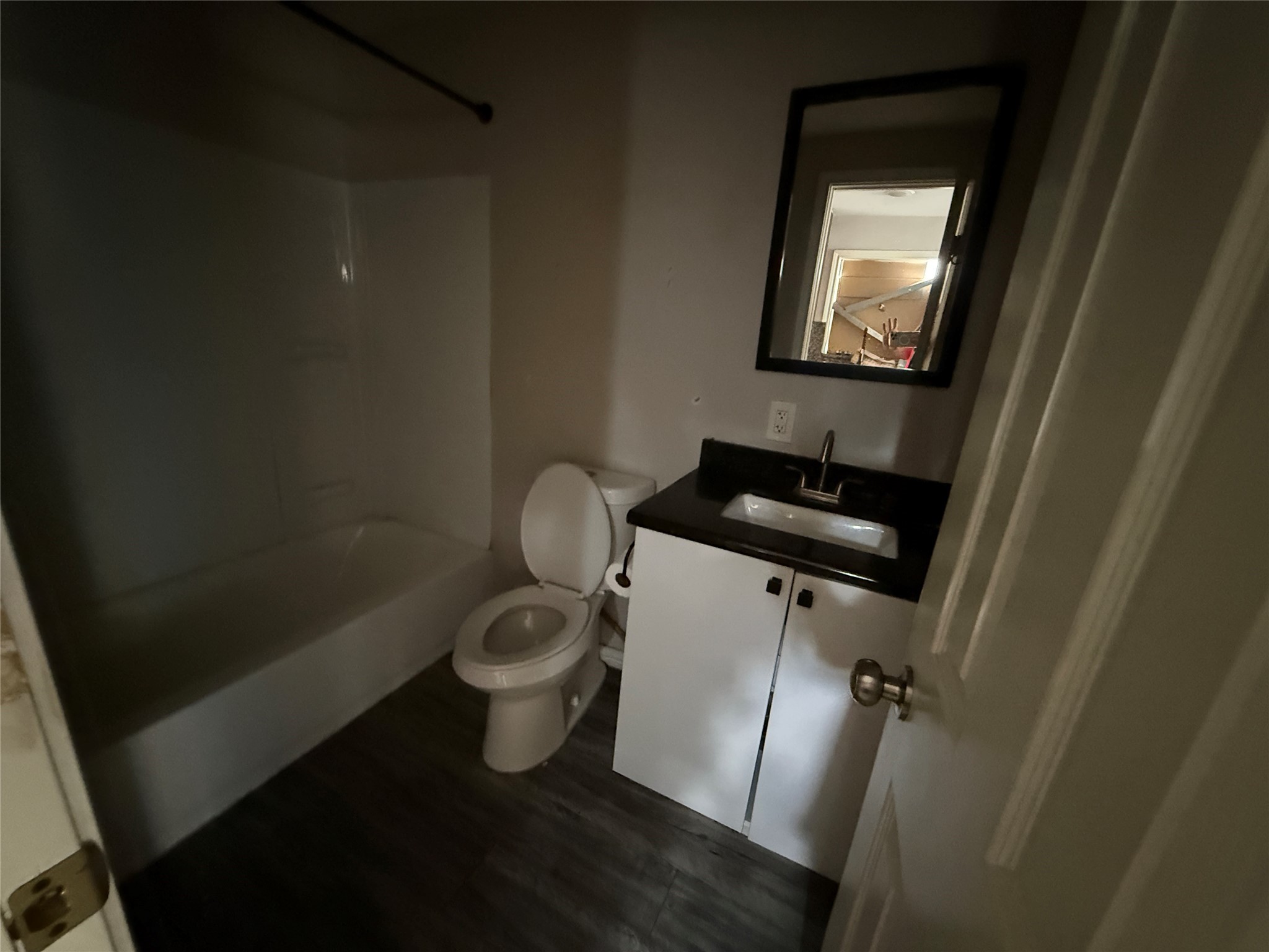 4011-4017 Terry Street Houston, TX 77009 - Photo 40 of 48 a bathroom with a toilet a sink and mirror