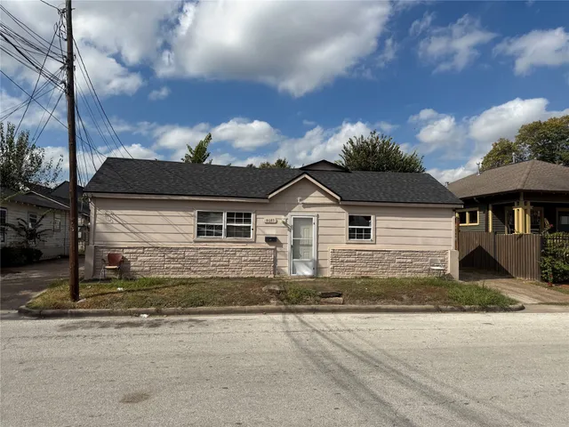 a view of a house next to a yard