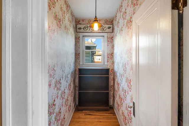 a view of walk in closet with clothes