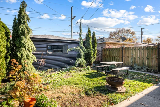 a wooden bench sitting in front of a building