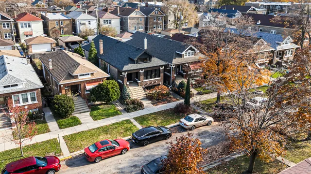 an aerial view of residential houses with outdoor space