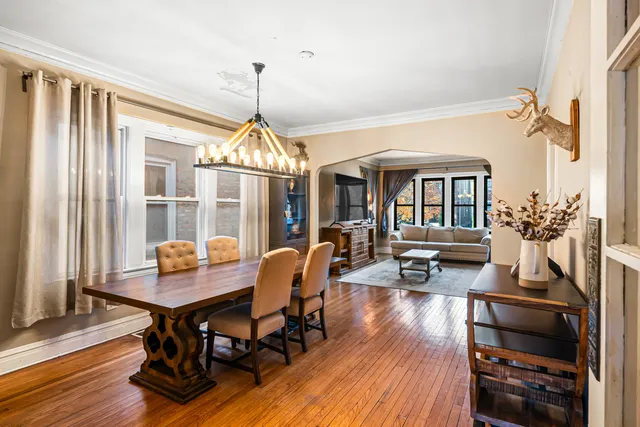 a view of a dining room with furniture window and wooden floor