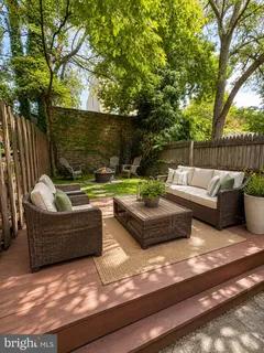 a view of a patio with couches chairs and a fire pit