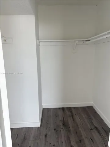 a view of an empty walk in closet
