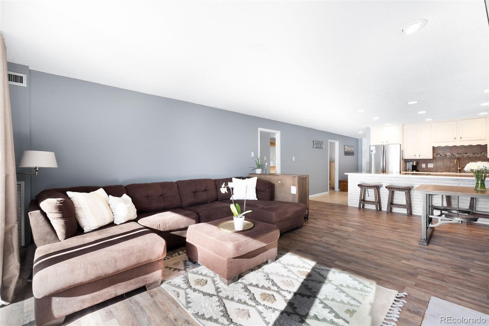 760 Copper Road, Unit F204 Frisco, CO 80443 - Photo 3 of 30 a living room with furniture and a table