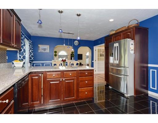 38 Thoreau Circle Beverly, MA 01915 - Photo 13 of 26 a kitchen with stainless steel appliances a sink cabinets and wooden floor
