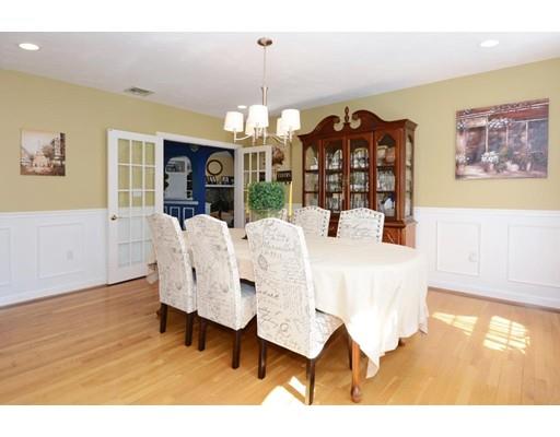 38 Thoreau Circle Beverly, MA 01915 - Photo 17 of 26 a view of a dining room with furniture and chandelier