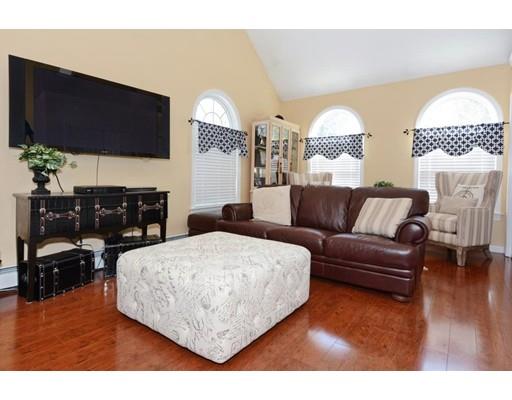 38 Thoreau Circle Beverly, MA 01915 - Photo 18 of 26 a living room with furniture and a flat screen tv