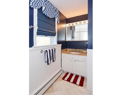 38 Thoreau Circle Beverly, MA 01915 - Photo 22 of 26 a view of a hallway with washer and dryer