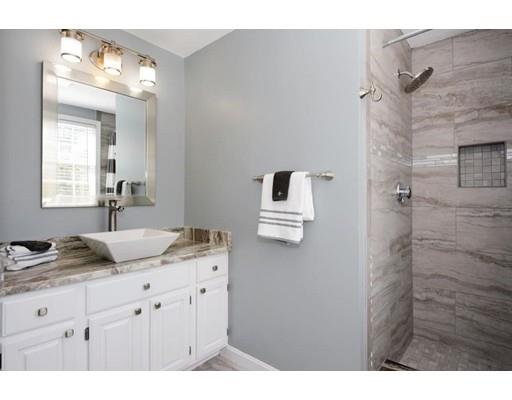 38 Thoreau Circle Beverly, MA 01915 - Photo 24 of 26 a bathroom with a granite countertop sink mirror and vanity