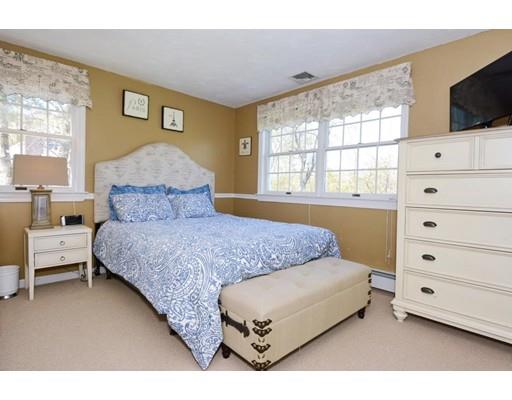 38 Thoreau Circle Beverly, MA 01915 - Photo 26 of 26 a bedroom with a bed and a flat screen tv
