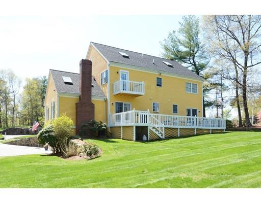 38 Thoreau Circle Beverly, MA 01915 - Photo 3 of 26 a view of a house with a big yard and large trees