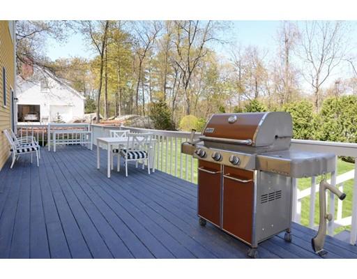 38 Thoreau Circle Beverly, MA 01915 - Photo 4 of 26 a view of a deck with table and chairs and wooden floor