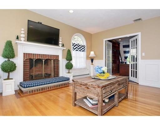 38 Thoreau Circle Beverly, MA 01915 - Photo 10 of 26 a living room with furniture a flat screen tv and a fireplace