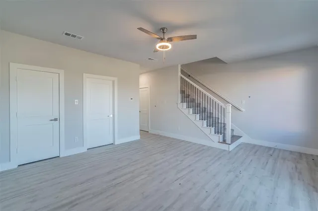 a view of an entryway with wooden floor